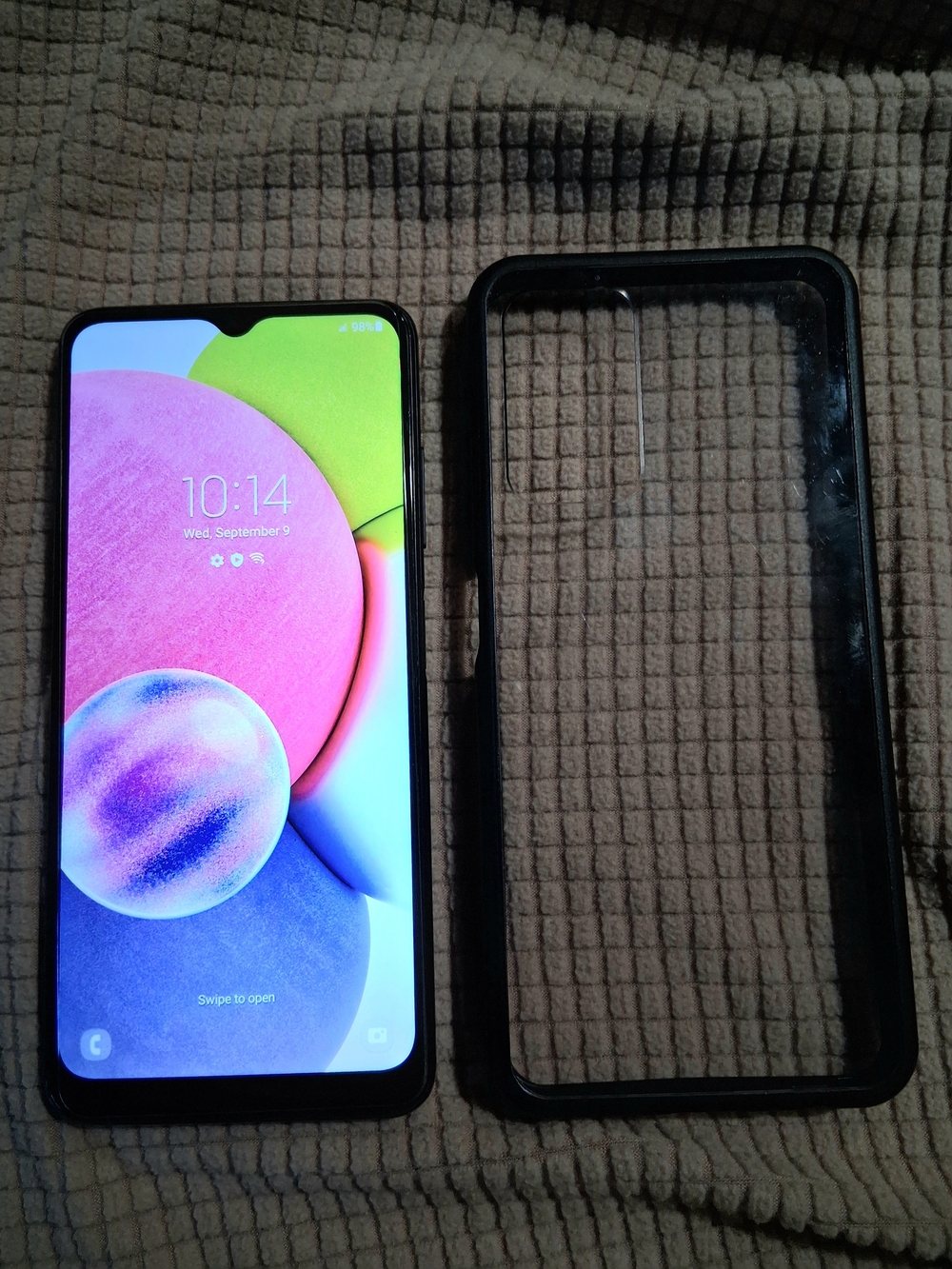 Samsung Galaxy A-Series Smartphone with Black Protective Case